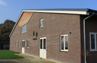 nieuwbouw manege met inpandige woning Ospel
